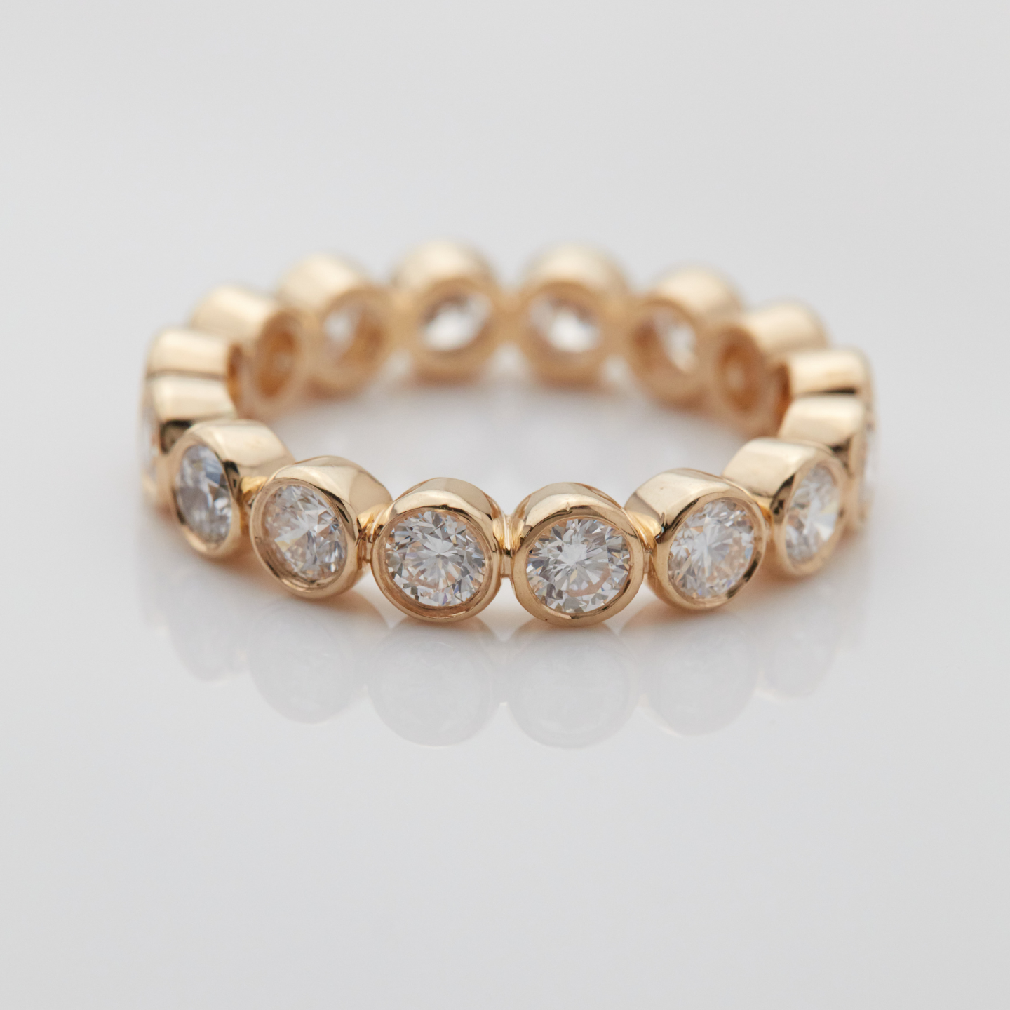 14k gold round diamond bezel set eternity ring with lab-created diamonds
