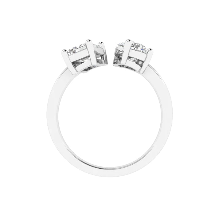 Emerald and pear diamond Toi et Moi ring featuring an elegant pairing of an emerald-cut diamond and a pear-shaped diamond, set in 14k
