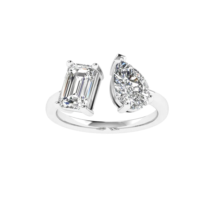 Emerald and pear diamond Toi et Moi ring featuring an elegant pairing of an emerald-cut diamond and a pear-shaped diamond, set in 14k