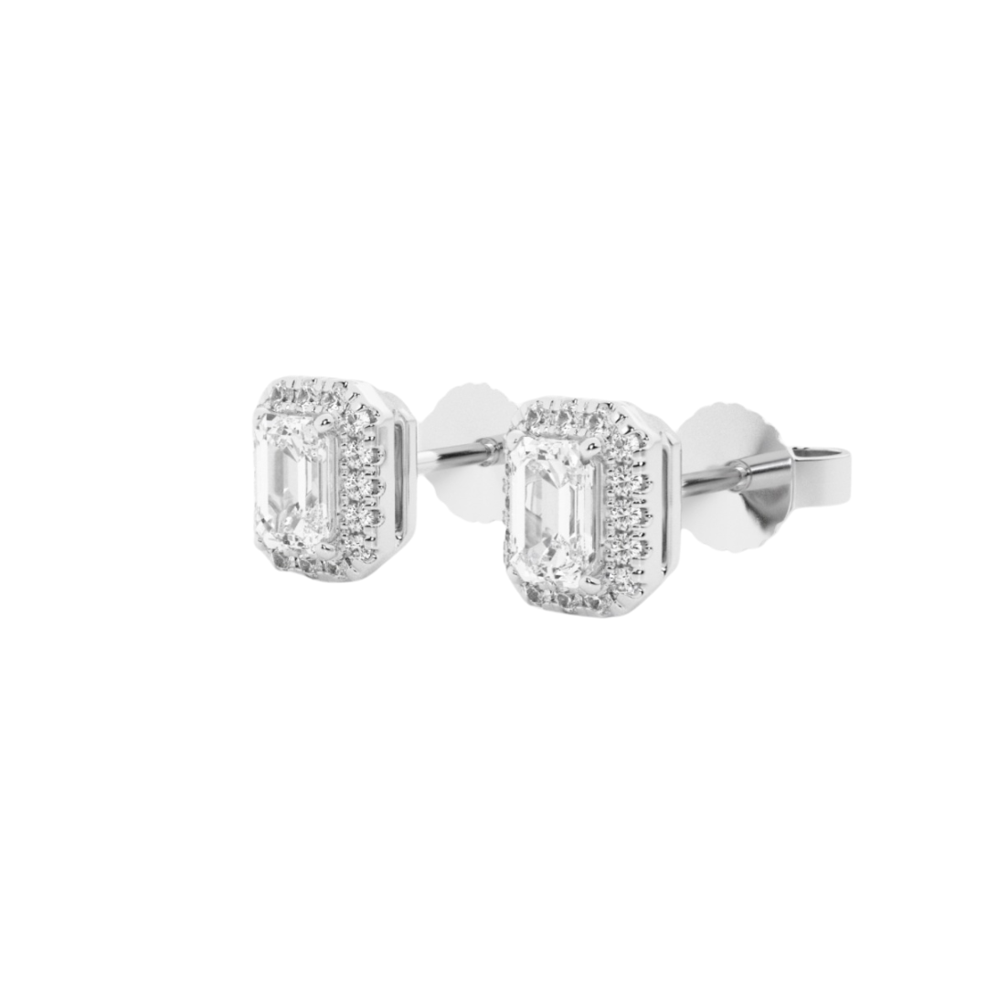 Emerald cut diamond stud earrings with a sparkling halo of smaller diamonds, set in 14k