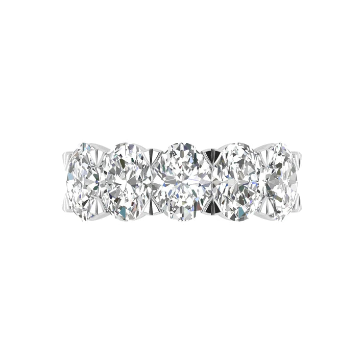 Five-stone ring featuring 5 carats of oval cut diamonds, elegantly set in a sleek band for a timeless and luxurious look