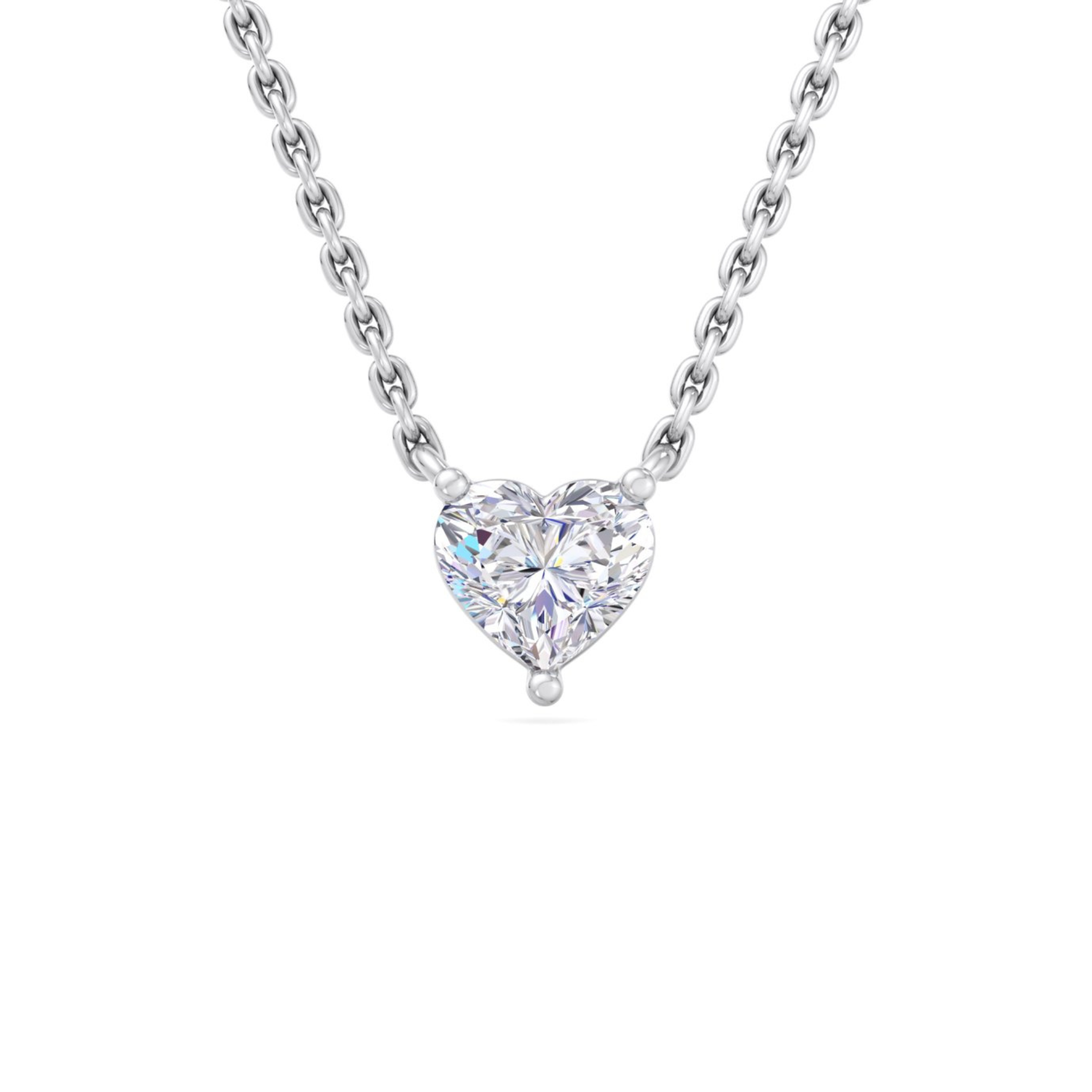 A gold necklace featuring a heart-shaped diamond pendant surrounded by sparkling round-cut diamonds, designed with elegance and charm.