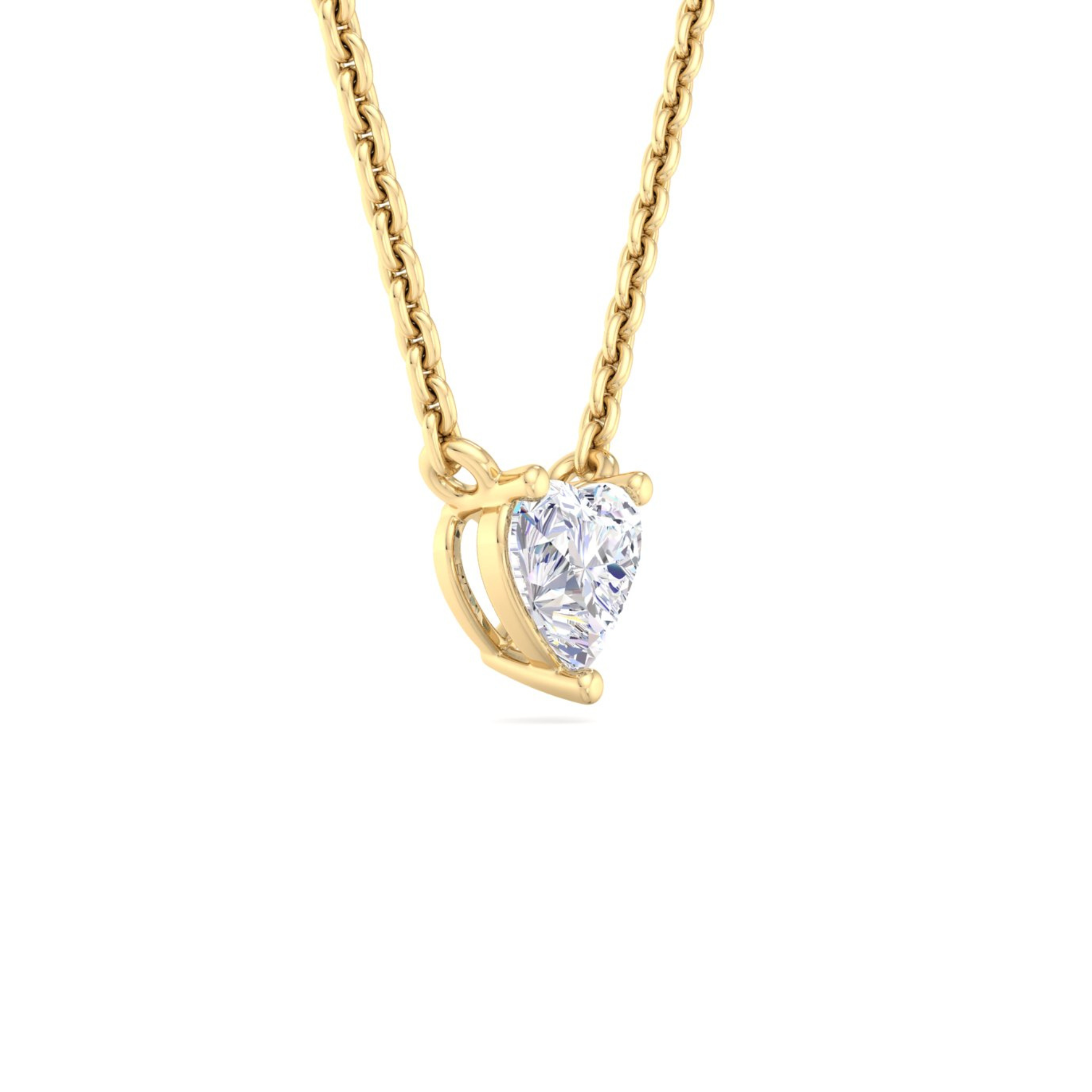 A gold necklace featuring a heart-shaped diamond pendant surrounded by sparkling round-cut diamonds, designed with elegance and charm.