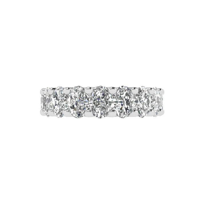 Oval diamond eternity band with 5 carat total weight, featuring a seamless row of sparkling oval-shaped diamonds in an elegant and timeless design.