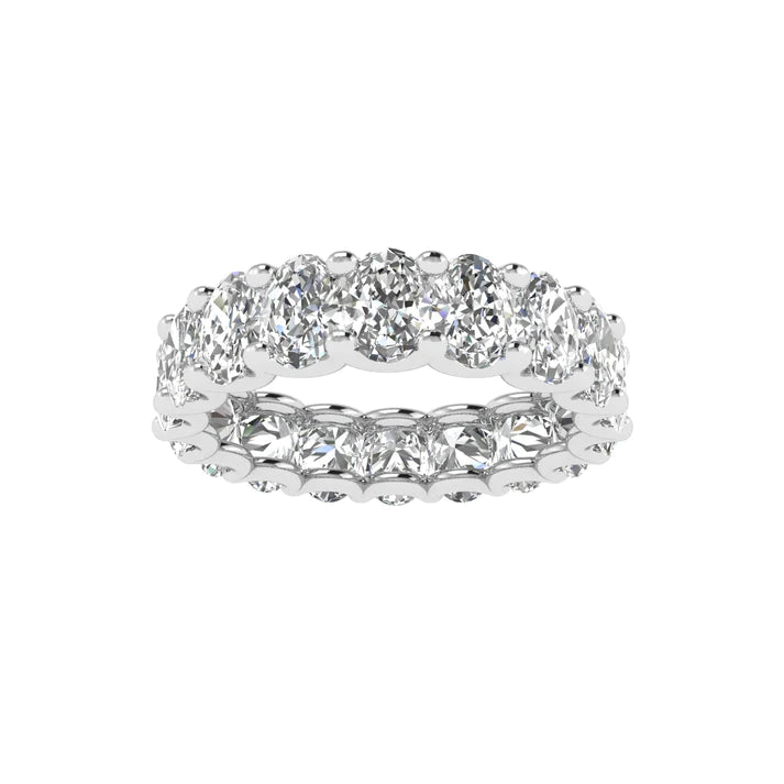 Oval diamond eternity band with 5 carat total weight, featuring a seamless row of sparkling oval-shaped diamonds in an elegant and timeless design.