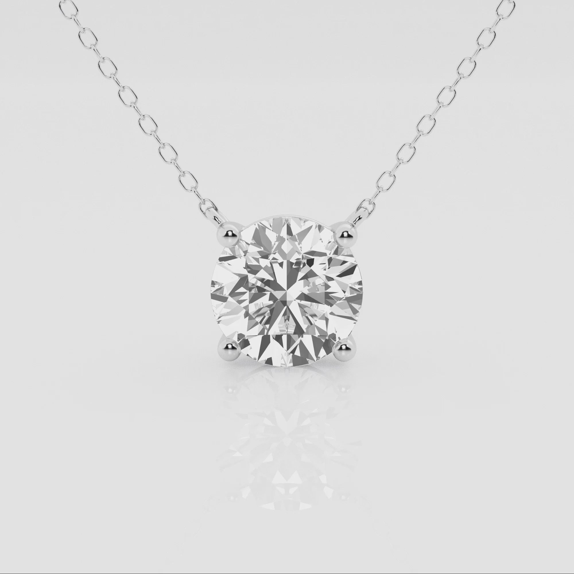 14k gold round diamond solitaire pendant with lab-created diamond by Sakaris Jewelers