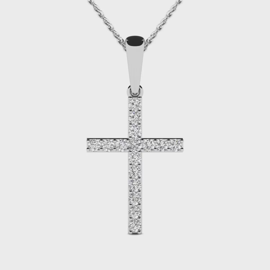 Round diamond cross pendant featuring 16 brilliant diamonds set in 14k gold, available in white, yellow, or rose gold.