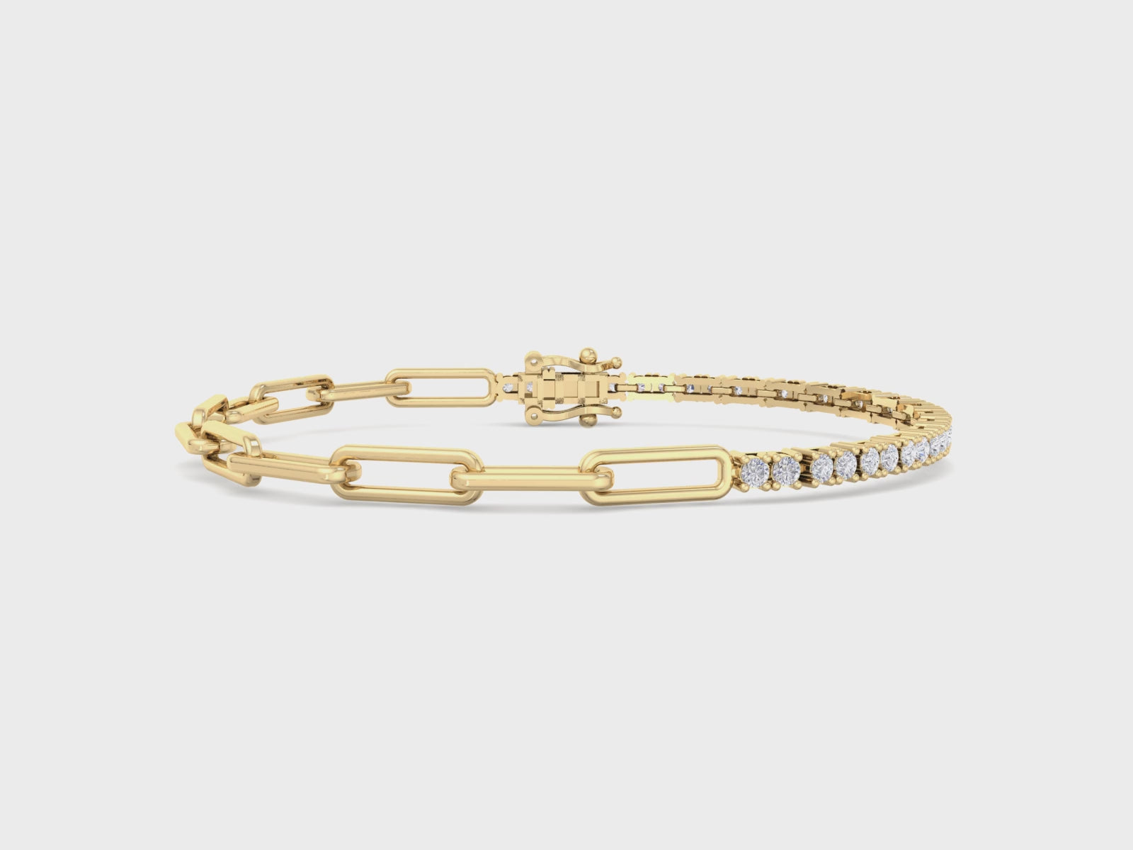 A gold bracelet featuring half a sleek paperclip chain and half a diamond tennis bracelet with sparkling round-cut diamonds, designed for elegance and style.