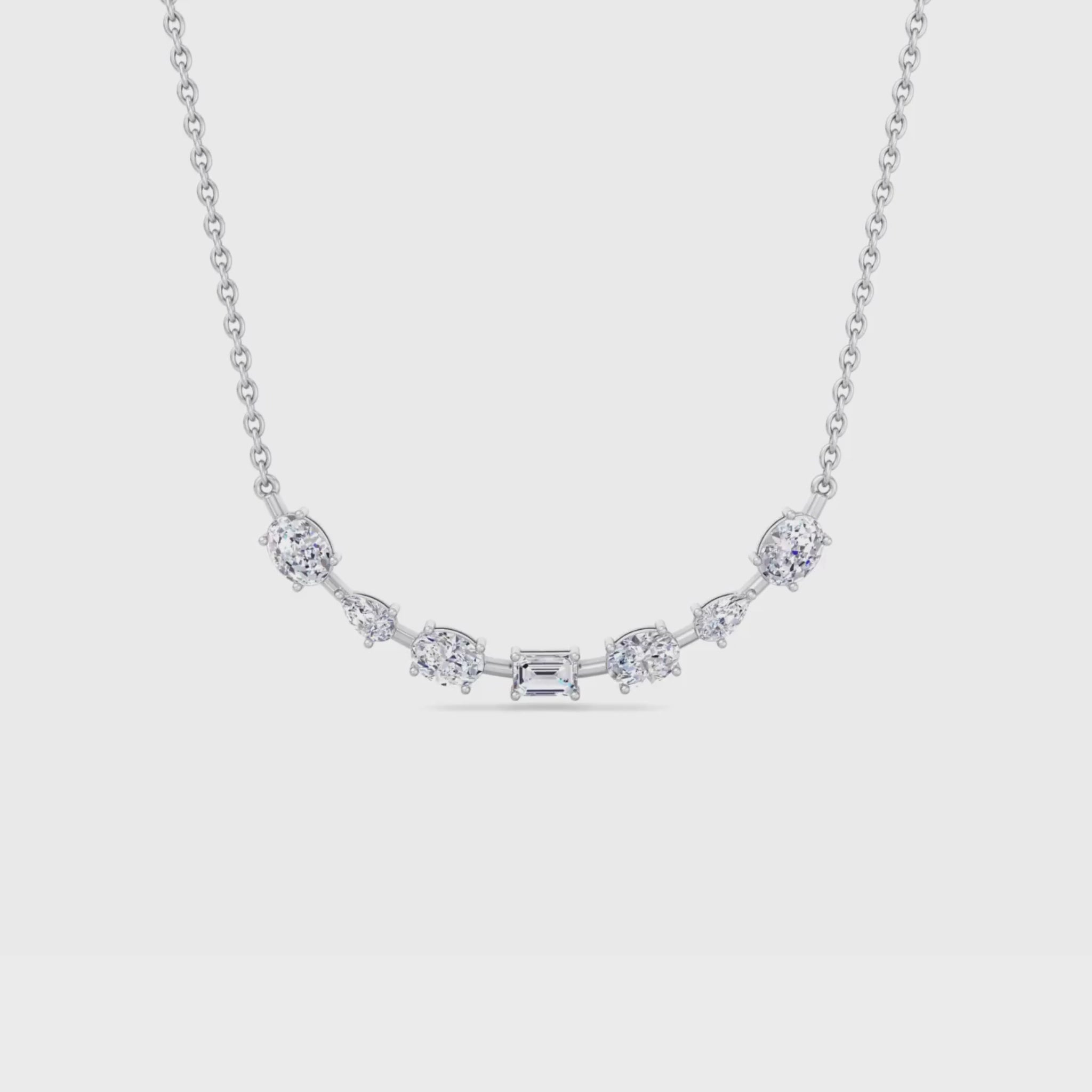 14K gold smile necklace featuring oval, pear, and emerald-cut diamonds in a curved design for a radiant and elegant look.
