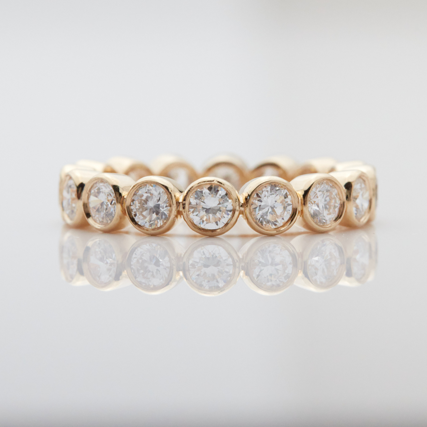 14k gold round diamond bezel set eternity ring with lab-created diamonds