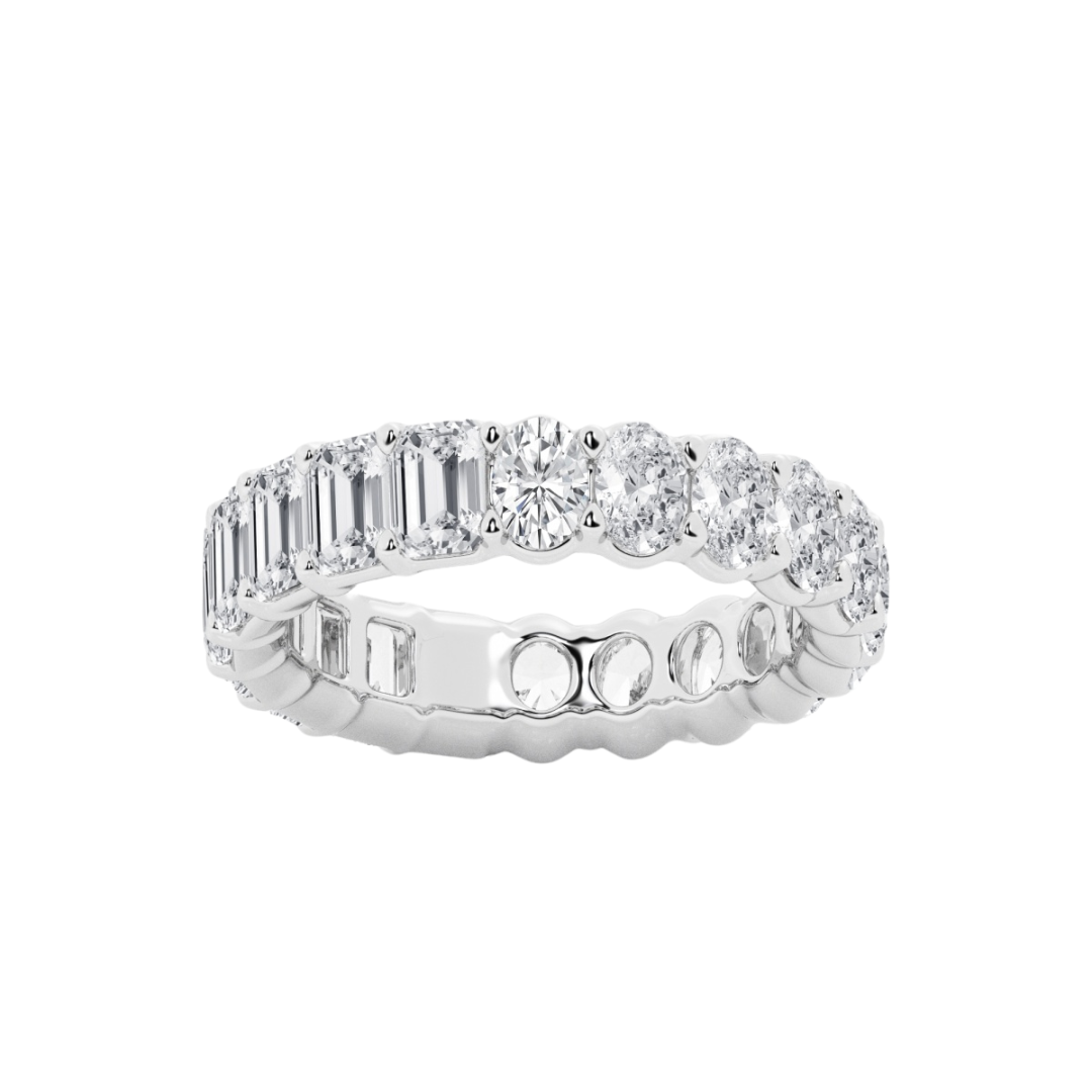 Diamond eternity ring featuring alternating emerald cut and oval cut diamonds, available in 4 carat and 6 carat total weights, set in 14k