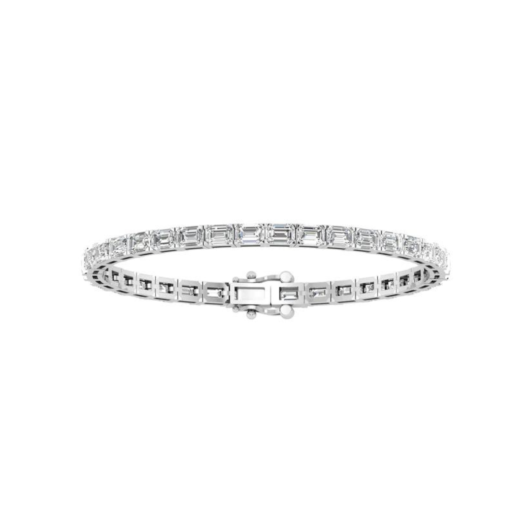 East to west emerald cut diamond tennis bracelet featuring brilliant emerald cut diamonds set horizontally in a sleek and elegant design.
