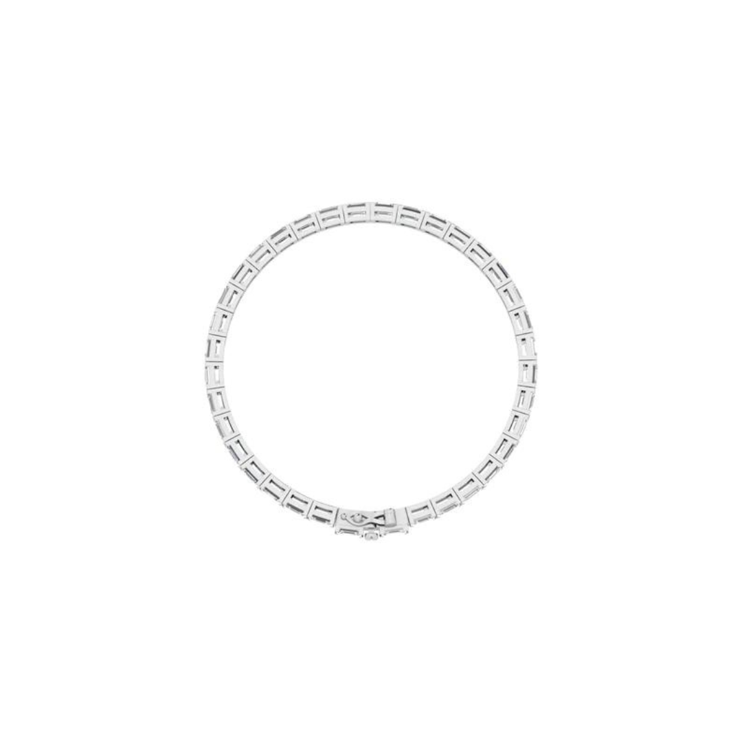 East to west emerald cut diamond tennis bracelet featuring brilliant emerald cut diamonds set horizontally in a sleek and elegant design.