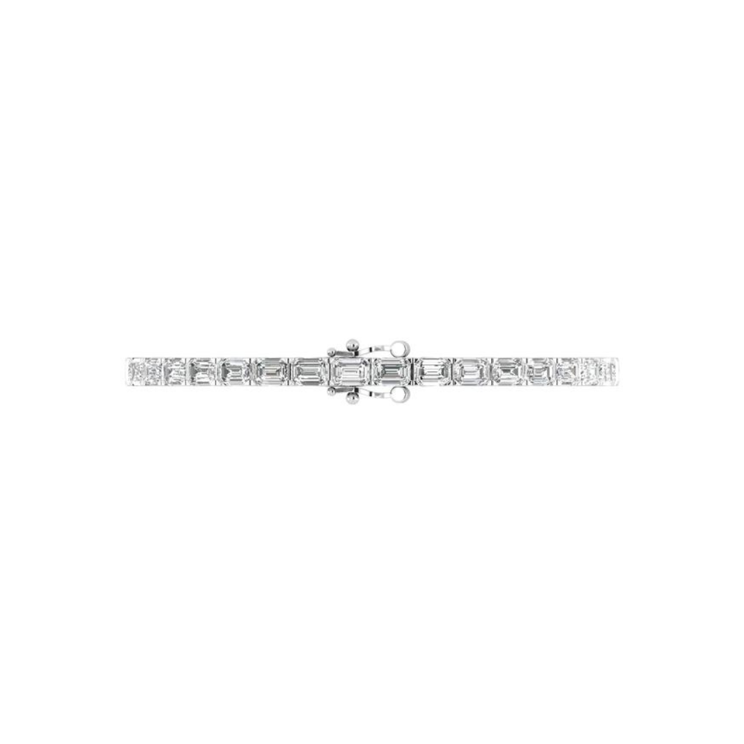 East to west emerald cut diamond tennis bracelet featuring brilliant emerald cut diamonds set horizontally in a sleek and elegant design.