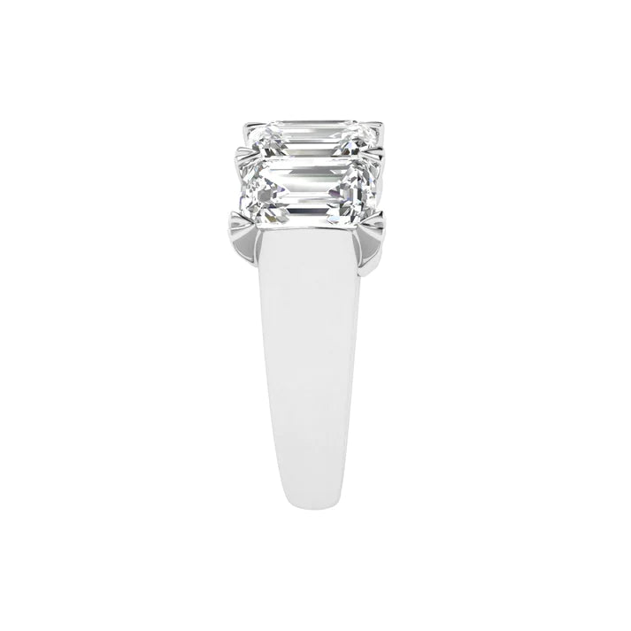 Five stone emerald cut diamond ring featuring 5 carats total weight, with elegant diamonds set in a sleek and timeless band.