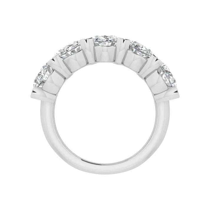 Five-stone ring featuring 5 carats of oval cut diamonds, elegantly set in a sleek band for a timeless and luxurious look