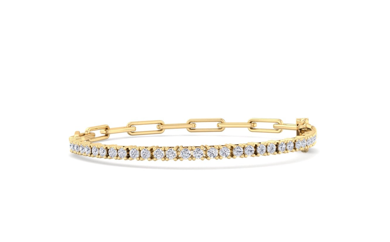 A gold bracelet featuring half a sleek paperclip chain and half a diamond tennis bracelet with sparkling round-cut diamonds, designed for elegance and style.