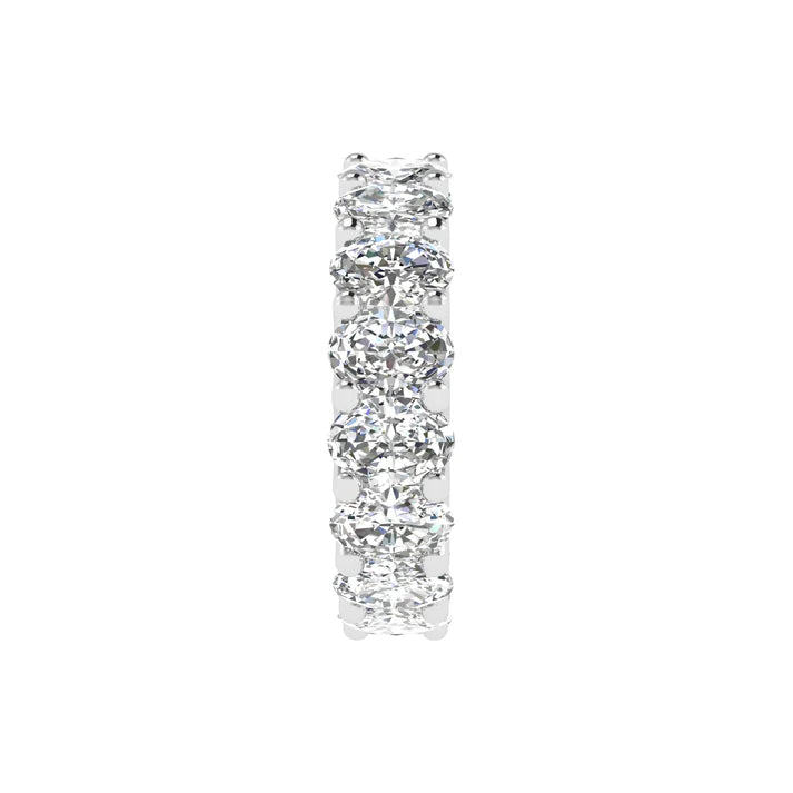 Oval diamond eternity band with 5 carat total weight, featuring a seamless row of sparkling oval-shaped diamonds in an elegant and timeless design.