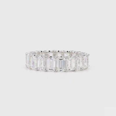 360-degree view of an emerald cut diamond eternity band in white gold