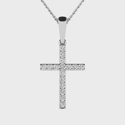 Round diamond cross pendant featuring 16 brilliant diamonds set in 14k gold, available in white, yellow, or rose gold.