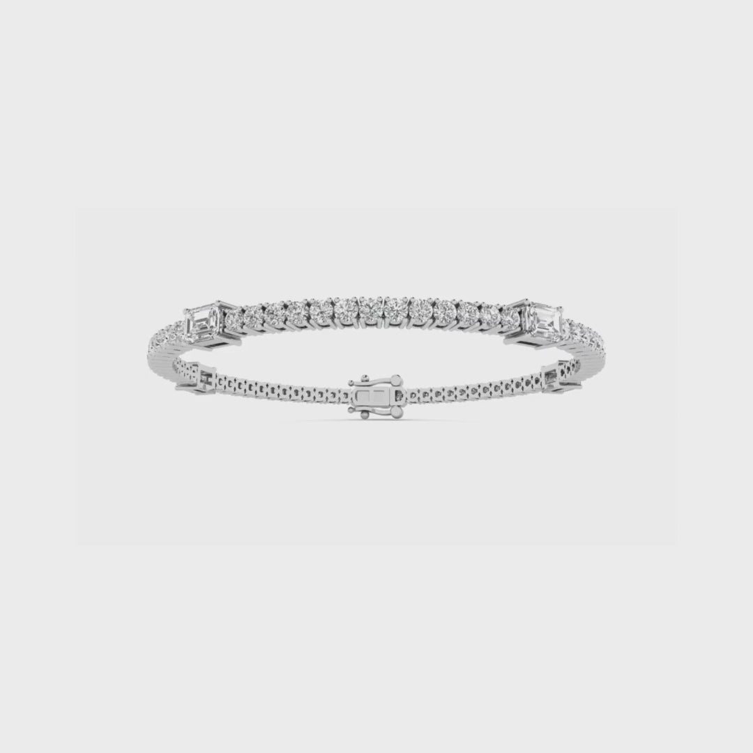 14k gold tennis bracelet with round and emerald cut lab-created diamonds by Sakaris Jewelers