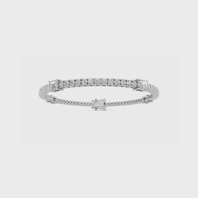 14k gold tennis bracelet with round and emerald cut lab-created diamonds by Sakaris Jewelers