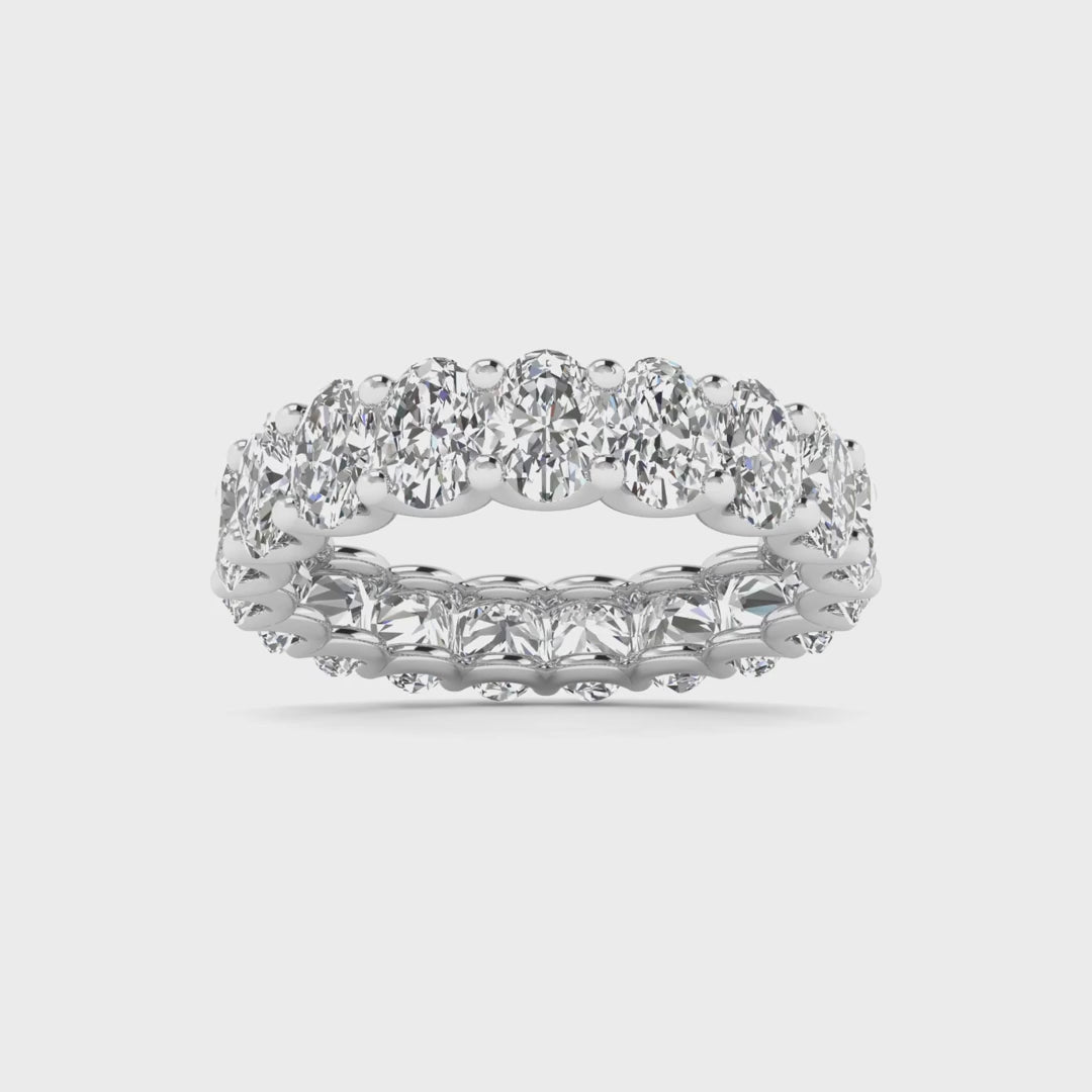 Oval diamond eternity band available in 3 carat and 4 carat total weight, featuring a continuous circle of brilliant oval-shaped diamonds in an elegant design.