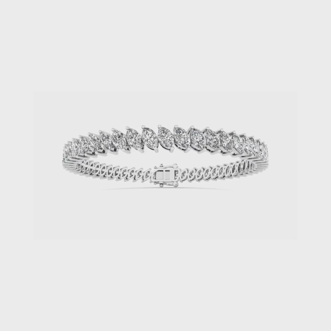 14K gold tennis bracelet featuring marquise-cut diamonds set in a continuous row for a sophisticated and timeless look.
